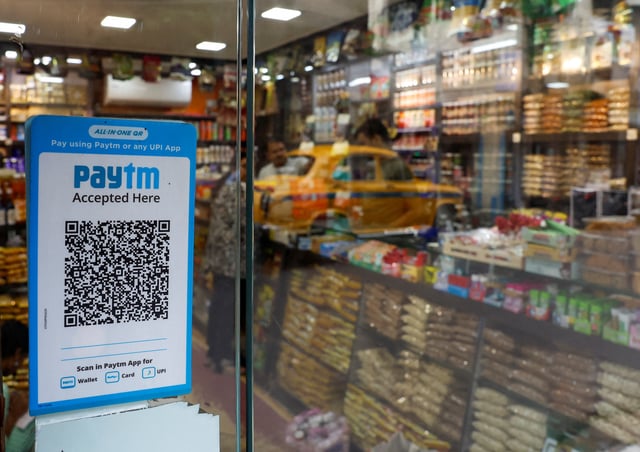 A QR code sticker of the digital payment app Paytm is seen outside a grocery store in Kolkata, India July 9, 2024. REUTERS/Sahiba Chawdhary 