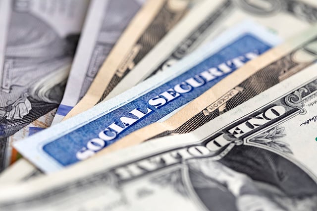 Stock image/file photo: A Social Security card with U.S. Dollars.