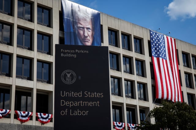 The U.S. Department of Labor is seen on August 29, 2025 in Washington, D.C. The large portrait of Trump is part of a pro-American display that has appeared at the U.S. Department of Labor ahead of Labor Day weekend. (Photo by Samuel Corum/Sipa USA)(Sipa via AP Images)