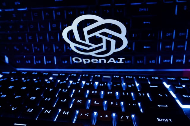 A keyboard is placed in front of a displayed OpenAI logo in this illustration taken February 21, 2023. REUTERS/Dado Ruvic/Illustration