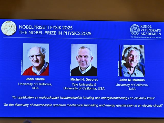 Photos of John Clarke, Michel H Devoret and John M. Martinis are pictured on a screen after they were announced as winners of the Nobel Prize in Physics, at the Nobel Assembly of the Karolinska Institutet, in Stockholm, Sweden, Tuesday, Oct. 7, 2025. (Christine Olsson/TT News Agency via AP)