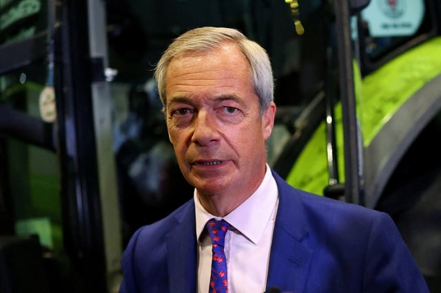 Britain's Reform UK party leader Nigel Farage stands next to a tractor during the Reform UK party conference, in Birmingham, Britain, September 6, 2025. REUTERS/Isabel Infantes/File Photo