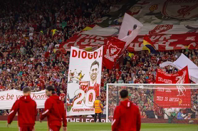 LIVERPOOL, ENGLAND - Friday, August 15, 2025: Liverpool supporters holding up a banner to pay tribute to Diogo Jota, who died in a car accident in July, on the Spion Kop before the FA Premier League match between Liverpool FC and AFC Bournemouth at Anfield. (Photo by David Rawcliffe/Propaganda)