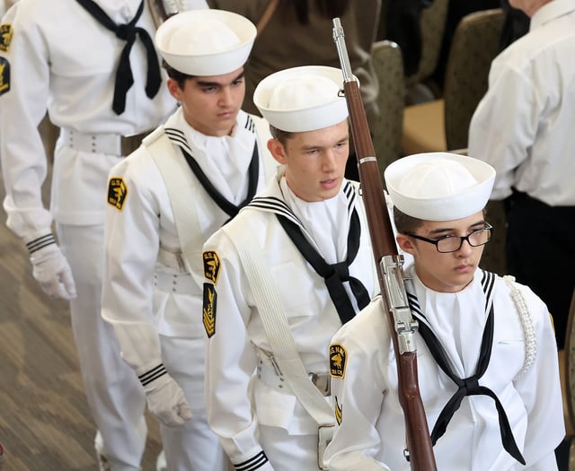 US Navy Sea Cadets march out of the room after posting the colors for the start of the Navy's 250th birthday celebration at the Puget Sound Navy Museum on Friday, Sept. 26, 2025.