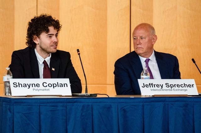 Shayne Coplan (left), founder and CEO of Polymarket, with Jeffrey Sprecher, chairman and CEO of Intercontinental Exchange.