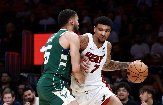 Heat center Kel'el Ware drives against Milwaukee's Pete Nance during the second half at Kaseya Center on October 06, 2025 in Miami, Florida. (Carmen Mandato/Getty Images)