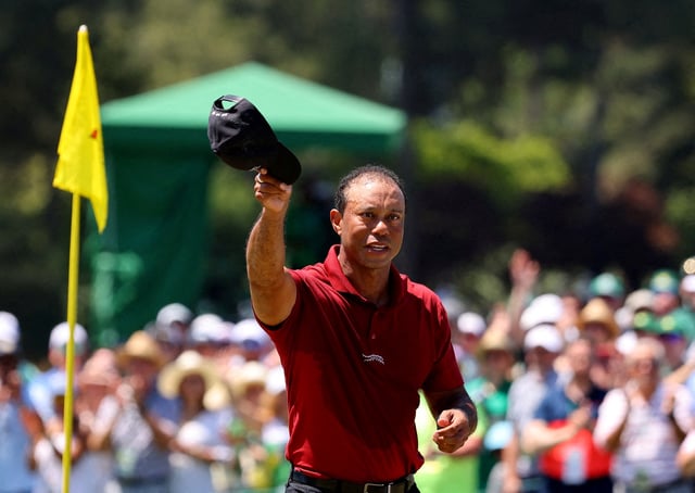 Golf - The Masters - Augusta National Golf Club, Augusta, Georgia, U.S. - April 14, 2024 Tiger Woods of the U.S. acknowledges the crowd on the green on the 18th hole after completing his final round REUTERS/Mike Blake/File Photo