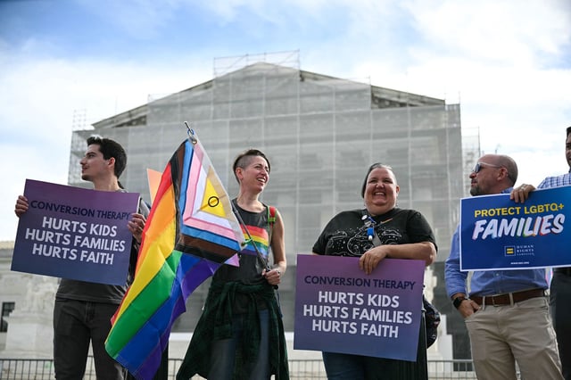 Demonstrators protest against conversion therapy outside the US Supreme Court in Washington, DC, as the Court hears oral arguments in Chiles v. Salazar, a landmark case on conversion therapy, on October 7, 2025.
