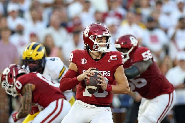 NORMAN, OKLAHOMA - SEPTEMBER 06: John Mateer #10 of the Oklahoma Sooners drops back to pass against the Michigan Wolverines during the first half at Gaylord Family Oklahoma Memorial Stadium on September 06, 2025 in Norman, Oklahoma. (Photo by Stacy Revere/Getty Images)