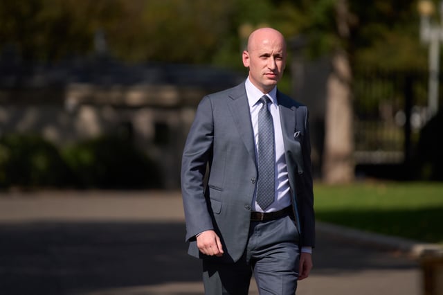 White House deputy chief of staff Stephen Miller walks to speak with reporters at the White House, Monday, Oct. 6, 2025, in Washington. (AP Photo/Evan Vucci)