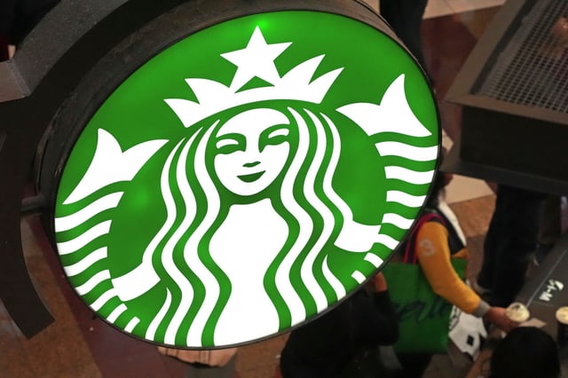 Starbucks has teamed up with Hello Kitty for a holiday lineup of merchandise. FILE - The Starbucks sign is seen at a Starbucks kiosk in the Walden Galleria in Buffalo in 2024. (AP Photo/Gene J. Puskar, File)
