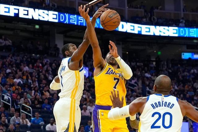 SAN FRANCISCO, CALIFORNIA - OCTOBER 05: Jonathan Kuminga #1 of the Golden State Warriors blocks the shot of Gabe Vincent #7 of the Los Angeles Lakers in the half of a preseason NBA game at Chase Center on October 05, 2025 in San Francisco, California. NOTE TO USER: User expressly acknowledges and agrees that, by downloading and or using this photograph, User is consenting to the terms and conditions of the Getty Images License Agreement. (Photo by Thearon W. Henderson/Getty Images)