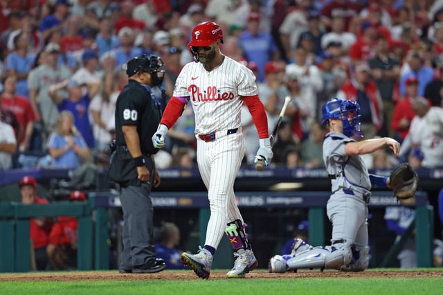 PHILADELPHIA, PENNSYLVANIA - OCTOBER 06: Bryce Harper #3 of the Philadelphia Phillies walks to the dugout after striking out during the sixth inning against the Los Angeles Dodgers in game two of the National League Division Series at Citizens Bank Park on October 06, 2025 in Philadelphia, Pennsylvania. (Photo by Emilee Chinn/Getty Images)