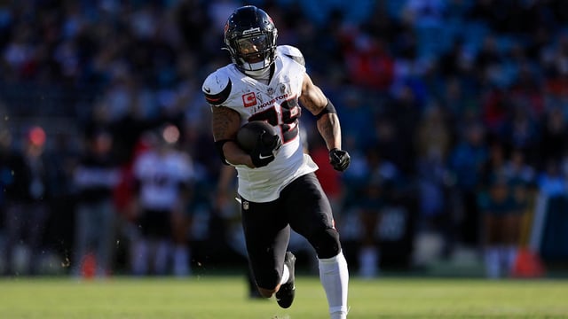 Houston Texans running back Joe Mixon (28) scores a touchdown during the third quarter of an NFL football matchup Sunday, Dec. 1, 2024 at EverBank Stadium in Jacksonville, Fla. The Texans held off the Jaguars 23-20. [Corey Perrine/Florida Times-Union]