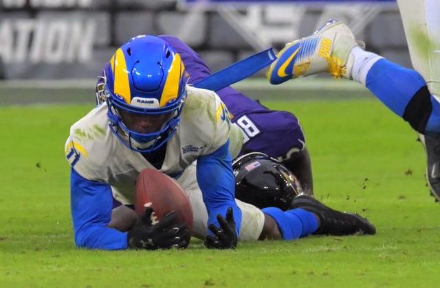 Los Angeles Rams cornerback Darious Williams grabs a fumble in front of Baltimore Ravens wide receiver Marquise Brown for the final play.