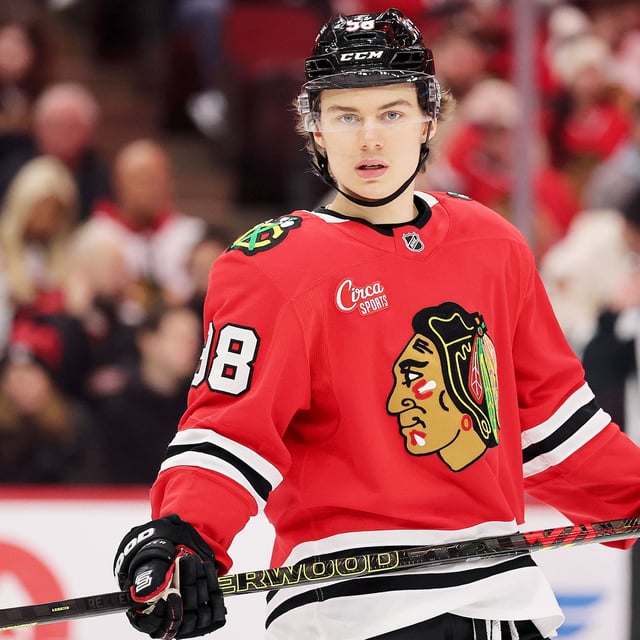  Connor Bedard #98 of the Chicago Blackhawks looks on against the New York Rangers during the first period at the United Center on January 05, 2025 in Chicago, Illinois. 