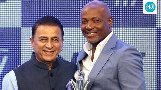 Indian cricket legend Sunil Gavaskar (L) presents the lifetime achievement award to ex-West Indies stalwart Brian Lara at the CEAT awards in Mumbai on Tuesday. (PTI)