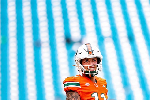 MIAMI GARDENS, FLORIDA - SEPTEMBER 13: Carson Beck #11 of the Miami Hurricanes  warms up before facing the South Flordia Bulls at Hard Rock Stadium on September 13, 2025 in Miami Gardens, Florida. (Photo by Carmen Mandato/Getty Images)