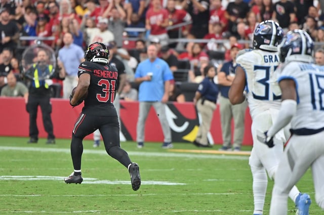 Arizona Cardinals running back Emari Demercado (31) runs the ball for 71 yards before fumbling against the Tennessee Titans during the fourth quarter at State Farm Stadium.