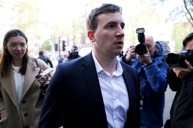 Christopher Cash, 29, who has been charged with spying for China, arrives at Westminster Magistrates' Court, in London, Britain, April 26, 2024. REUTERS/Hollie Adams