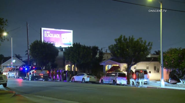 Members of the FBI and Los Angeles Police Department conduct a raid targeting members of the Rancho San Pedro street gang in San Pedro early Tuesday morning, Oct. 7. (Courtesy of OnScene. TV)