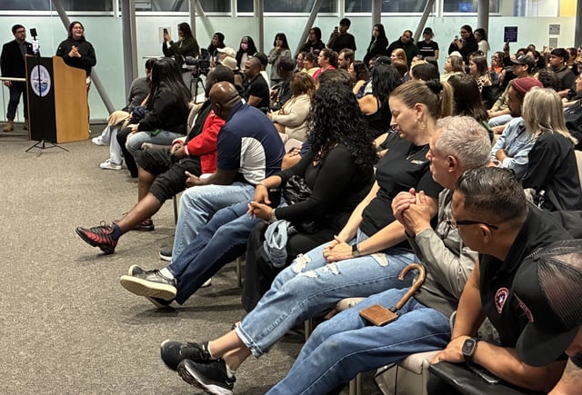 Dariana Fajardo speaks to a standing-room-only crowd just over an hour after she was released from federal custody for allegedly impeding a federal investigation. Many of those in the Waukegan City Council Chambers on Monday came to protest her arrest. (Steve Sadin/For the Lake County News-Sun)