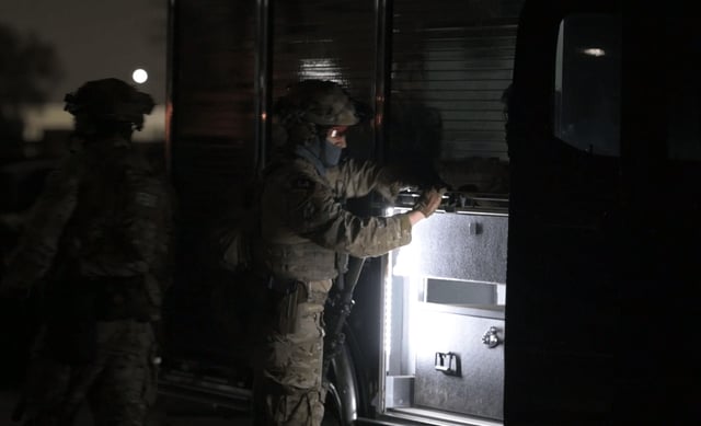 Law enforcement officers participate in an operation targeting members of a San Pedro gang Oct. 7, 2025. Image is from handout video provided by the FBI. 