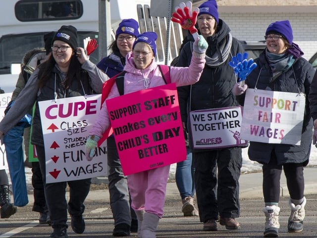 CUPE Local 3484 employees of Black Gold School Division walk the picket line along 50 Street in Leduc on Monday, Feb. 24, 2025, as 570 employees walked off the job joining more than 4,000 others on strike in Edmonton, Fort McMurray and Sturgeon County.