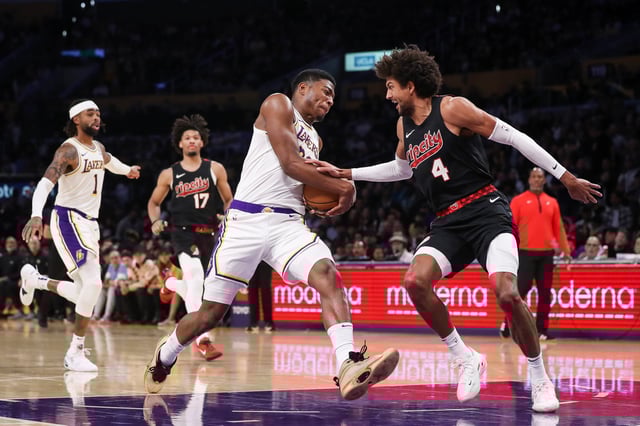 Rui Hachimura #28 of the Los Angeles Lakers drives with the ball defended by Matisse Thybulle #4 of the Portland Trail Blazers in the second half at Crypto.com Arena on November 12, 2023 in Los Angeles, California. NOTE TO USER: User expressly acknowledges and agrees that, by downloading and or using this photograph, User is consenting to the terms and conditions of the Getty Images License Agreement.