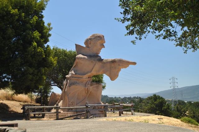 A statue of  Junipero Serra stands on a hilltop above Interstate 280 in Hillsborough, Calif. 