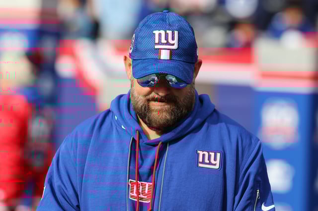 Head Coach Brian Daboll of the New York Giants walks onto the field before the start of their game against the Indianapolis Colts at MetLife Stadium.
