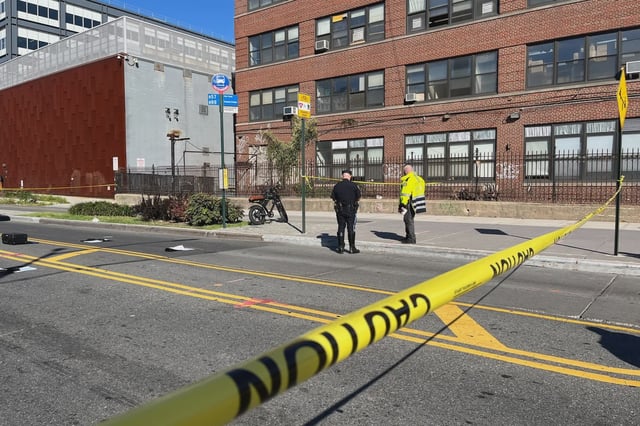 NYPD investigators survey the electric bicycle that killed Terri Valenti outside the Brooklyn Navy Yard on Monday.