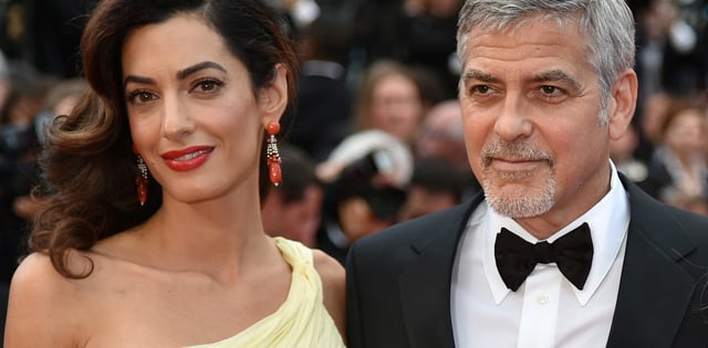 George Clooney y Amal Clooney. Foto: 
AFP PHOTO / ALBERTO PIZZOLI