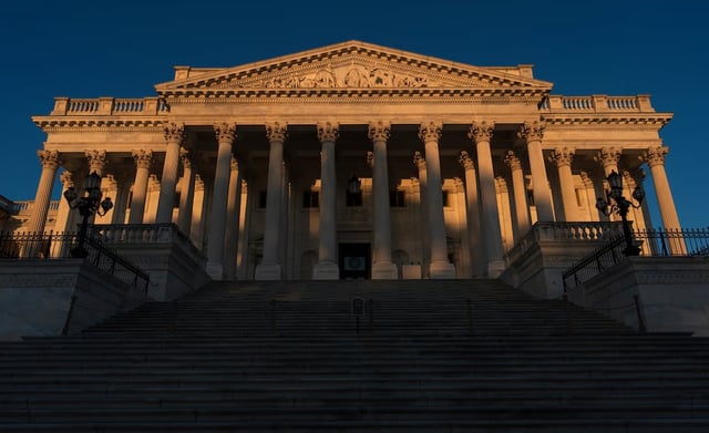The Senate is illuminated at dawn at the Capitol in Washington, Monday, Oct. 6, 2025.