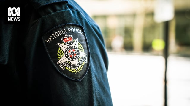 The Victoria Police insignia on the sleeve of an officer's shirt.