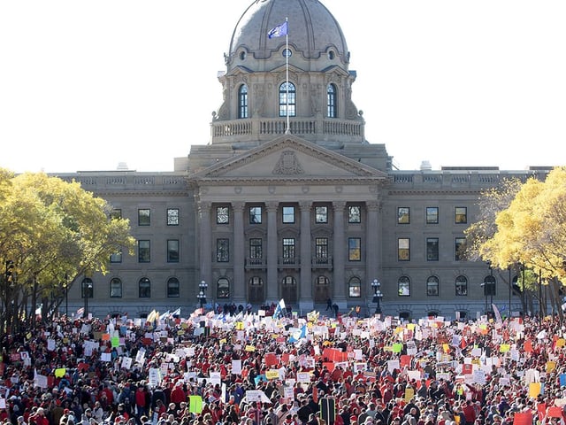 Thousands take part in a rally in support of teachers and public education outside the Alberta Legislature in Edmonton on Sunday, Oct. 5, 2025.