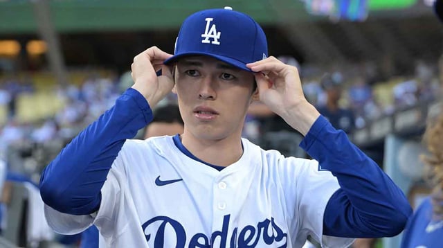 Sep 30, 2025; Los Angeles, California, USA; Los Angeles Dodgers starting pitcher Roki Sasaki (11) in the dugout prior to game one of the Wildcard round for the 2025 MLB playoffs against the Cincinnati Reds at Dodger Stadium. Mandatory Credit: Jayne Kamin-Oncea-Imagn Images