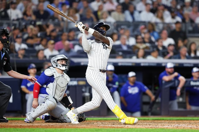 Oct 7, 2025; Bronx, New York, USA; New York Yankees second baseman Jazz Chisholm Jr. (13) hits a solo home run in the fifth inning against the Toronto Blue Jays during game three of the ALDS round for the 2025 MLB playoffs at Yankee Stadium. Mandatory Credit: Wendell Cruz-Imagn Images