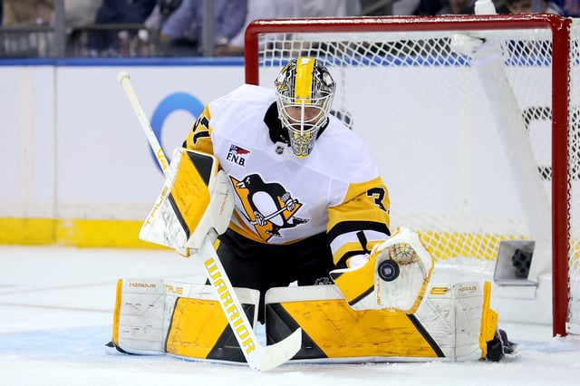 Oct 7, 2025; New York, New York, USA; Pittsburgh Penguins goaltender Arturs Silovs (37) makes a save against the New York Rangers during the first period at Madison Square Garden. Mandatory Credit: Brad Penner-Imagn Images