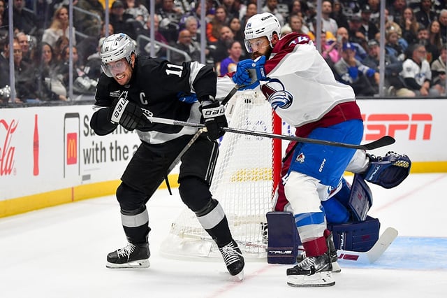 LOS ANGELES, CA - OCTOBER 7: Anze Kopitar #11 of the Los Angeles Kings and Brent Burns #84 of the Colorado Avalanche battle for position during the first period in the season opener at Crypto.com Arena on October 7, 2025 in Los Angeles, California. (Photo by Gary A. Vasquez/NHLI via Getty Images)