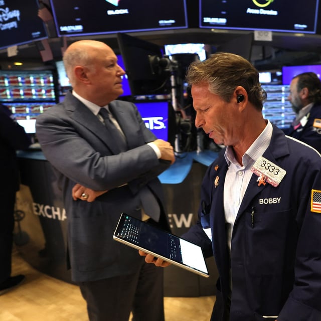 Traders work on the floor of the New York Stock Exchange (NYSE) in New York on October 7, 2025. Wall Street stocks edged higher early Tuesday, extending an upbeat stretch as markets continue to look past a US government shutdown that has curtailed economic data releases. (Photo by TIMOTHY A. CLARY / AFP) (Photo by TIMOTHY A. CLARY/AFP via Getty Images)