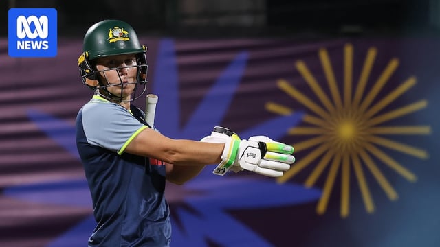Alyssa Healy pulls on her glove at training at the Women's Cricket World Cup.