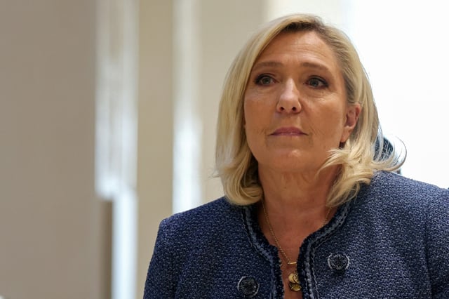 President of the parliamentary group of the French far-right Rassemblement National (RN) party, Marine Le Pen arrives at the Paris courthouse for her trial verdict on suspicion of embezzlement of European public funds, in Paris, on March 31, 2025. A French court sentenced on March 31, 2025 far-right leader Marine Le Pen to a five-year ban on running for office with immediate effect, throwing into doubt her bid to stand for President in 2027.
