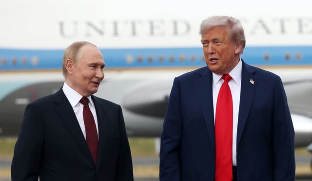 Russian President Putin (L) and U.S. President Donald Trump (R) pose for a photo during the welcoming ceremony prior to the meeing on war in Ukraine at U.S. Air Base at U.S. Air Base In Alaska on August 15, 2025, in Anchorage, Alaska, United States.