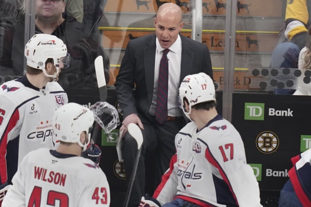 Washington Capitals head coach Spencer Carbery talks with his players during the third period of an NHL hockey game against the Boston Bruins, Monday, Dec. 23, 2024, in Boston.