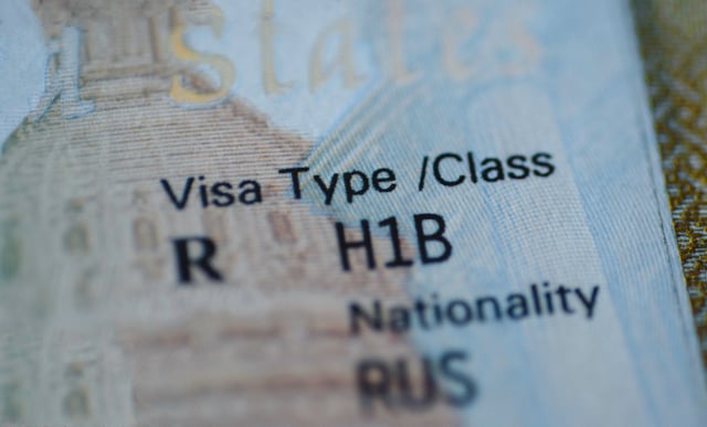 Fragment of H1B visa (for specialty workers) stamp in passport. The White House proposes new H-1B visa restrictions, aiming to protect U.S. workers but raising concerns about innovation, health care, and lawsuits. (iStock / Getty Images Plus)