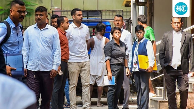 Late singer Zubeen Garg's cousin and Assam Police DSP Sandipan Garg, centre in white, is being produced at a court after his arrest in connection with the singer's death in Singapore last month.