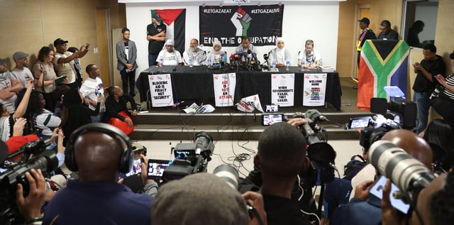 Zukiswa Wanner, Reaaz Moolla,⁠ Zaheera Soomar, Nkosi Mandla Mandela, Fatima Hendricks and Carolyn Shelver at a media briefing of Global Sumud Flotilla delegates to Gaza at OR Tambo International Airport on 8 October 2025. (Photo: Felix Dlangamandla)