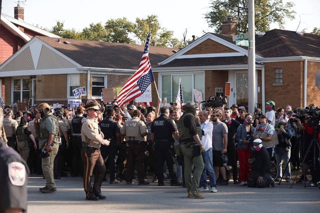 People protest outside the U.S. Immigration and Customs Enforcement (ICE) facility in the Chicago suburb of Broadview, Illinois, on Oct. 3, 2025.
