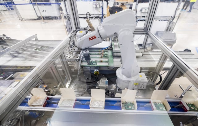 An ABB Ltd. robot places Raspberry Pi personal computers in to final packaging boxes on the production line at the Sony UK Technology Centre in Pencoed, UK, on Friday, Feb. 2, 2024. Personal computer maker Raspberry Pi appointed bankers at Peel Hunt and Jefferies to prepare a London initial public offering, a listing that would be a win for the UK capital after an exodus of companies to the US. Photographer: Chris Ratcliffe/Bloomberg via Getty Images